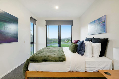 The main bedroom has an opening ranch slider that allows the fresh country air through.