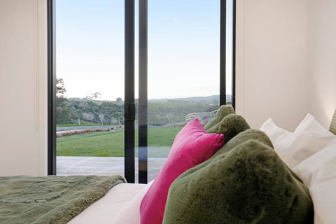 This bedroom is located at the front of the house and has the added benefit of the ranch sliders opening.