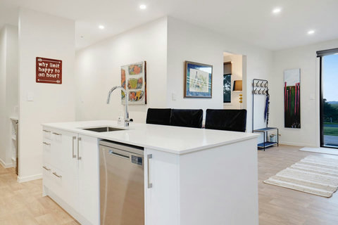 The kitchen has a gas cooktop, oven and dishwasher.
