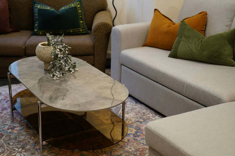 There is a handy coffee table for your drinks and popcorn.