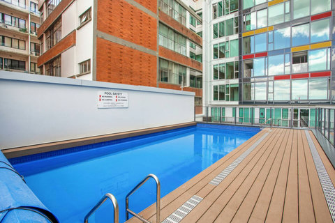 Enjoy swimming laps in the shared outdoor swimming pool.