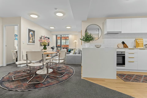 There is plenty of space in the apartment to have a full kitchen, dining table and living room.
