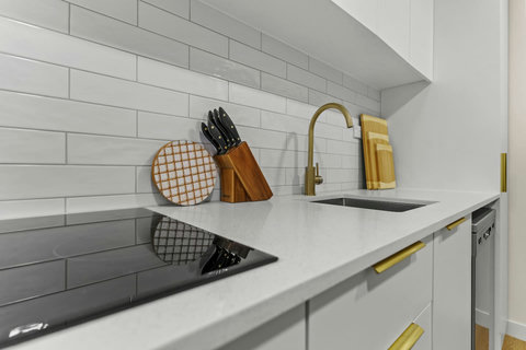 The kitchen has been renovated with luxe fixtures.