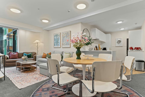 The use of rugs is a clever way of dividing spaces.