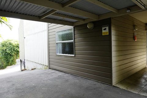 Undercover entrance into the apartment block.