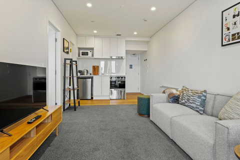 Relax on the couch and watch TV on the 43" screen.