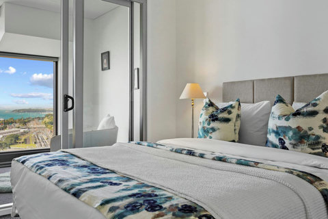 The bedroom opens onto the conservatory area and provides extra seating.