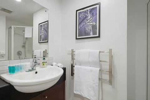 There is plenty of space on the vanity for your personal belongings.