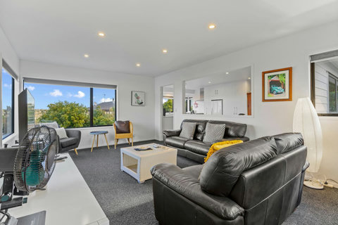 The main living room is part of the open-plan space including the kitchen and dining space.