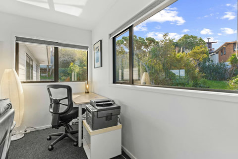 Imagine doing work here with the view outside, and there is the use of the office chair and printer.