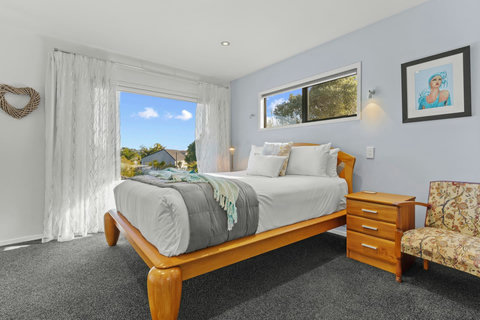 The Queen bed is a comfy place to rest with its neutral colourway.