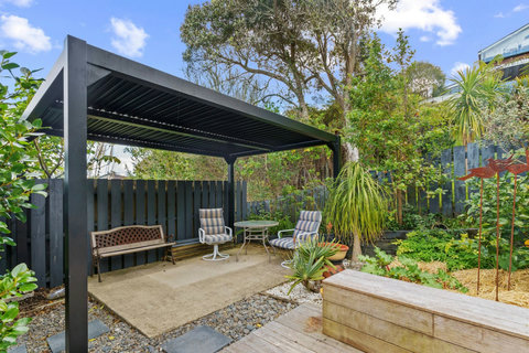 This lovely little seating area is covered for whatever the weather is.