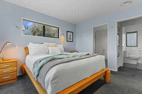 This bedroom has a Queen-sized bed with ensuite bathroom and double wardrobe.