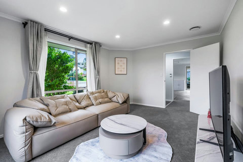 Relax on the couch and watch the TV or read a book.