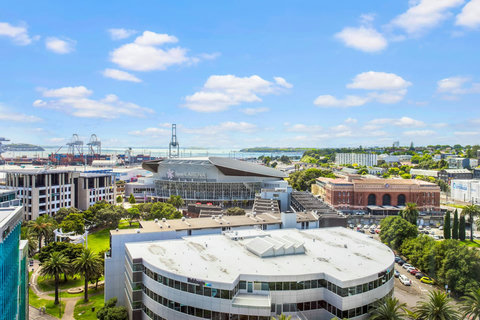 View out your apartment window looking towards Spark Arena and Auckland wharf.