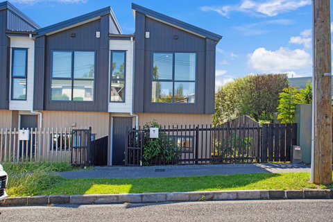 The house is set amongst other like houses.