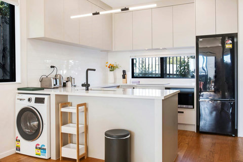 The combo washer and dryer is in the kitchen area.