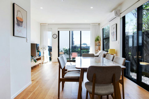 The open-plan living space includes the kitchen, dining and lounge areas.