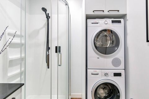 This apartment comes with full laundry facilities including a washer and dryer.