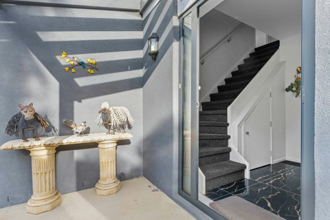 Upon entering the home, through the door, the 14 stairs will lead you to the upstairs level.