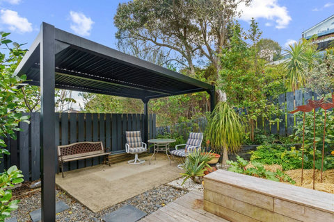 This lovely little seating area is covered for whatever the weather is.