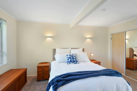 The main bedroom has a queen bed and a double wardrobe.