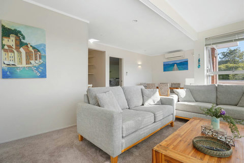 The living room is in between the dining area and kitchen making the best use of space.