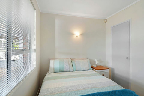 The second bedroom is smaller but still features a Queen bed.
