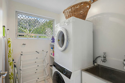 The laundry has a front loading washing machine and dryer which is perfect for longer stays.