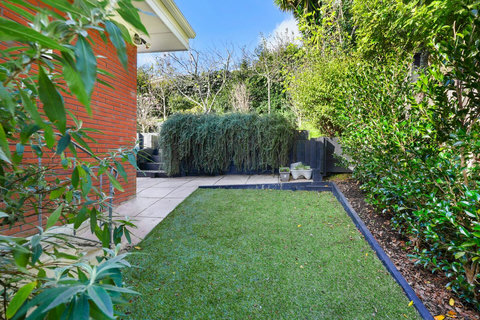 The backyard garden area is well-maintained.