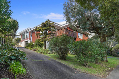 The home is located at the rear of the property with parking outside for one vehicle.