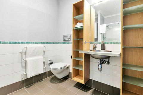 Bathroom with plenty of storage. Well lit.