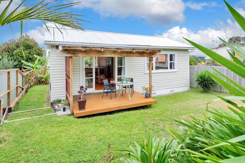 View of the cottage with the deck, living room and bedroom at the end.