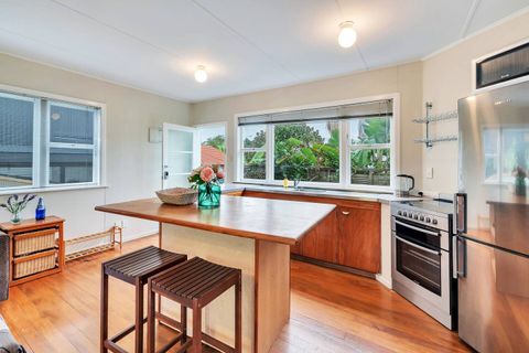 The kitchen includes an oven, cook top, fridge/freezer and microwave.