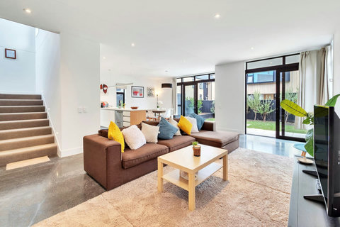 Open-plan living areas with polished concrete floors make for easy living.