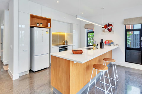 This kitchen also comes with a breakfast bar and seating for a casual meal.