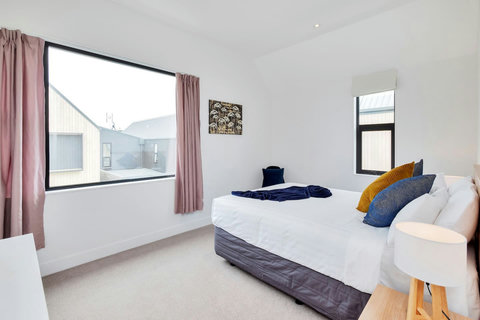 The main bedroom is at the front of the house and can be shut off from the rest of the house, turning it into your private suite.