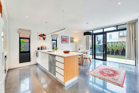 The kitchen has an oven, glass cooktop, microwave, dishwasher draws and fridge/freezer.