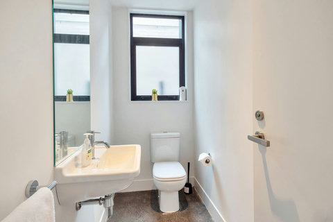 There is a separate downstairs toilet and vanity.