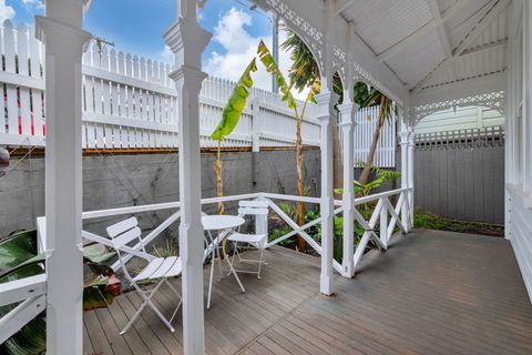Front patio and tropical garden.