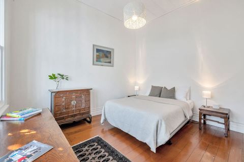 Lovely high ceilings help to create a feeling of space in this bright and airy bedroom.