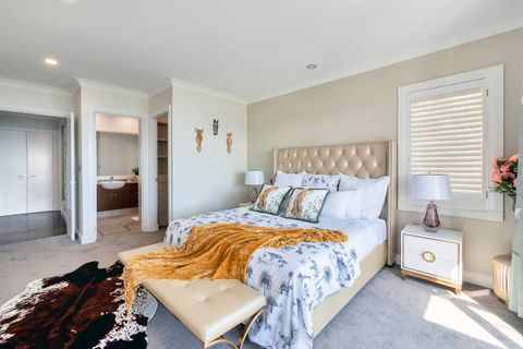 The Cheetah suite is decorated with throw pillows, an animal print duvet cover, a mustard throw and a cow-hide rug.