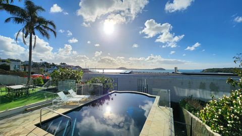 View of the pool and outdoor dining area.