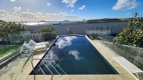 View of the pool and outdoor dining area.