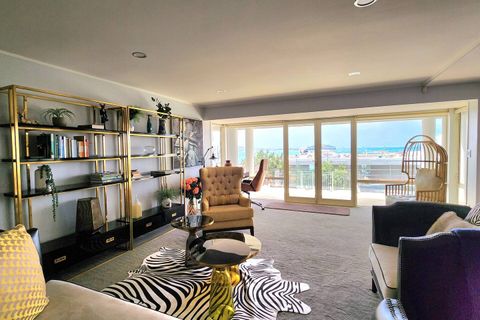 Unfortunately, in this living space, the stunning view is blocked by the construction that is occurring in the neighbouring property.