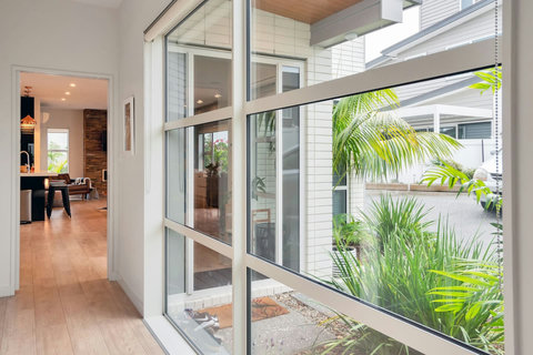 Hallway between living area, downstairs bedroom and garage