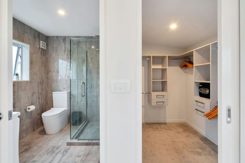 Upstairs master bedroom with ensuite and walk-in wardrobe.