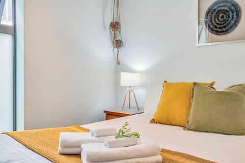 The room takes it tones of mustard and green from the curtains.