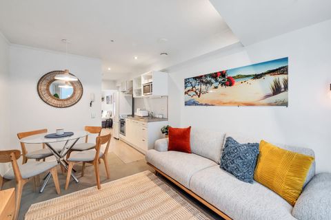 The couch has plenty of space to curl up and relax with a good book.