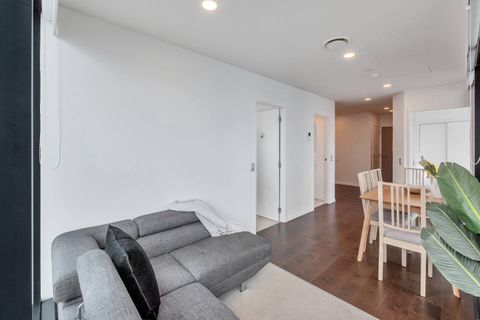 The open plan living and dining room. This apartment has polished wooden floors perfect for anyone with allergies. The colour pallet of this restrained and relaxed ready for you to kick back and chillax.
